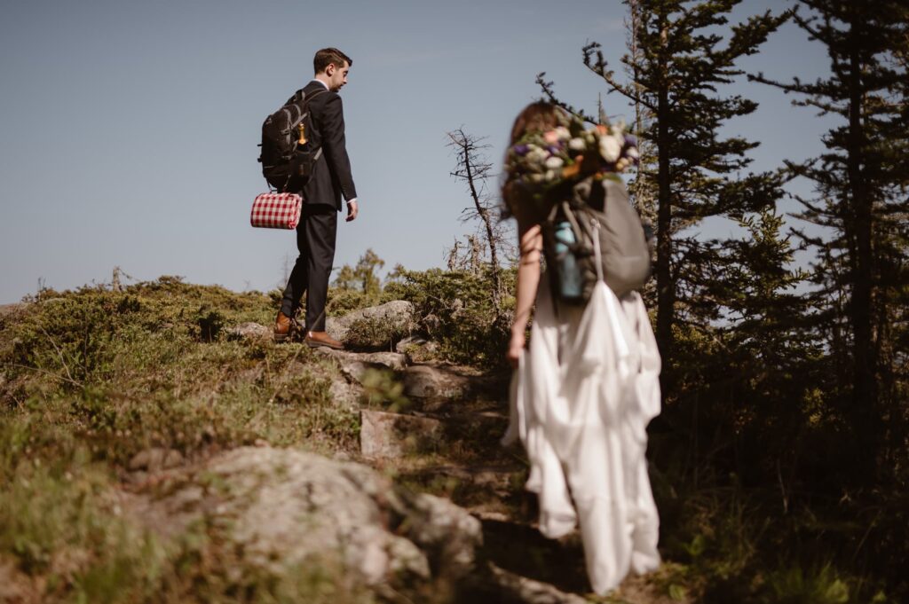 Bride and groom hiking along Isle Royale National Park during their elopement