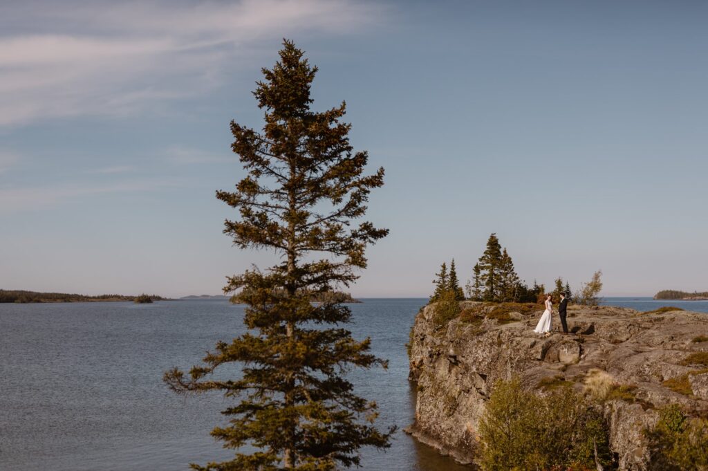 Couple getting married on a rocky peninsula in Isle Royale National Park