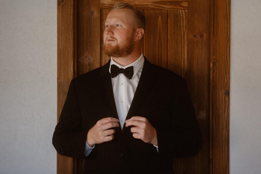 Groom wearing a tux for his Moab adventure elopement