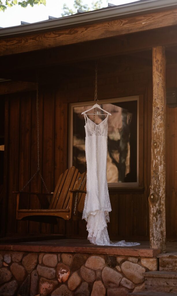 Wedding dress hanging on the front of Sorrel River Ranch