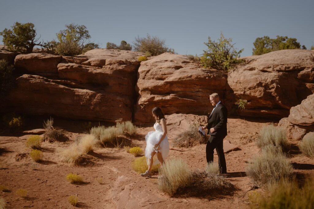 Couple walking to their ceremony site at Dead Horse Point State Park