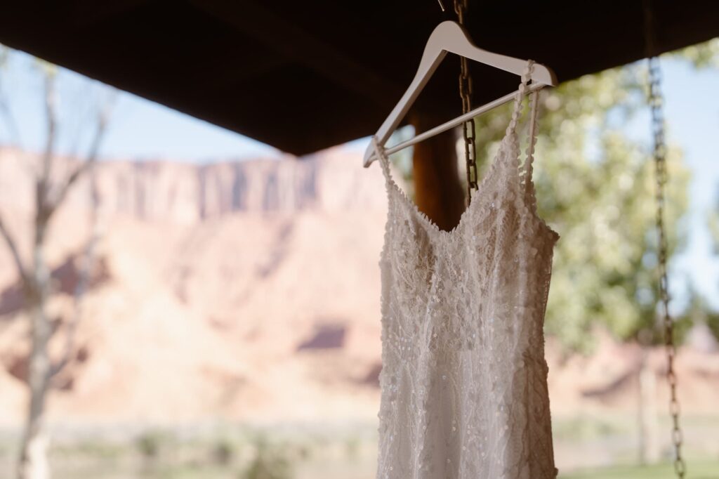 Wedding dress hanging on the porch of a ranch