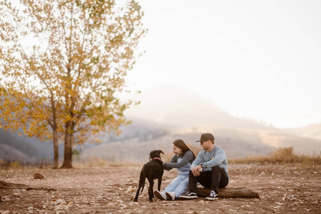 Couple in the mountains with their dog