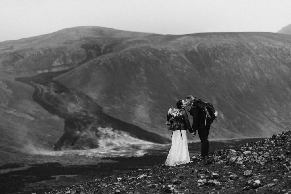 Couple kissing in front of a volcano in Iceland on their wedding day