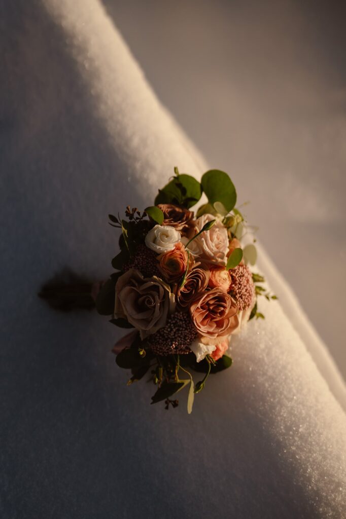 Blush and pink bouquet in the snow