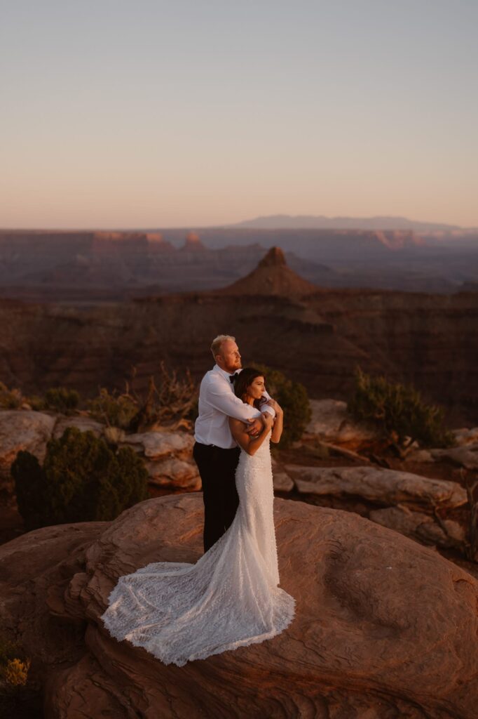 Sunset photo of couple on their elopement day in the desert