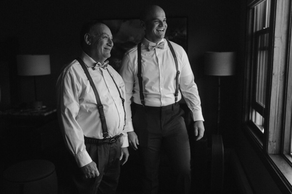 Groom and father of the bride getting ready together during a micro wedding