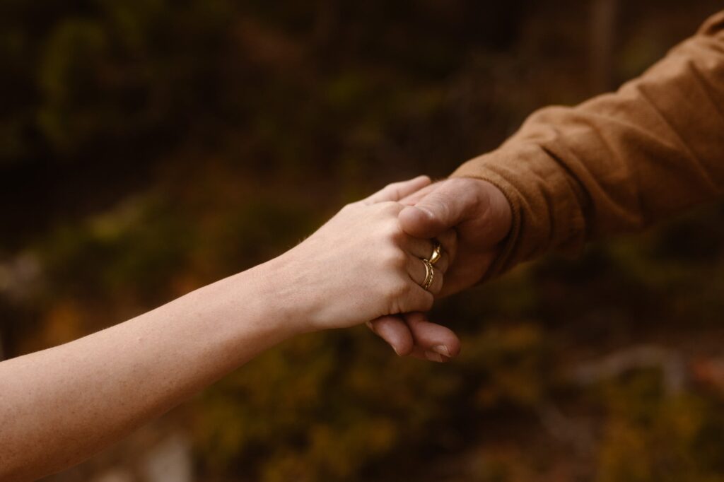 Detail photo of couple holding hands during engagement session