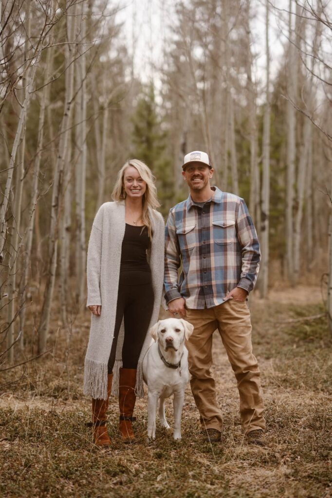 Engagement portraits with a dog in the aspen trees
