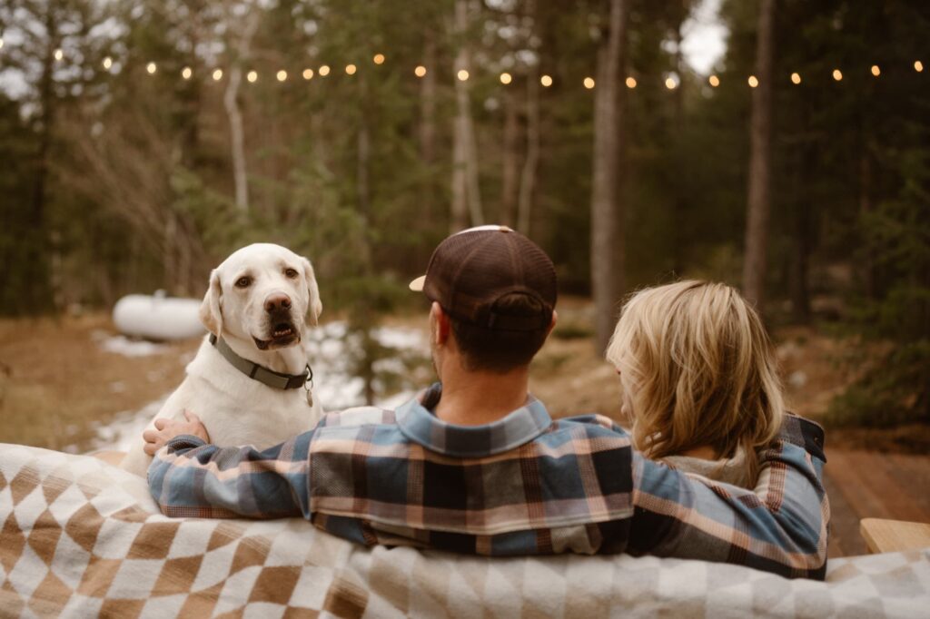 Dog looking at couple during their engagement session