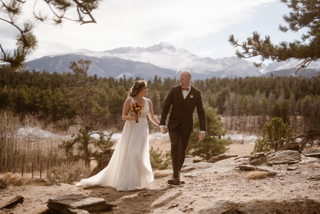 Bride and groom walking through Upper Beaver Meadows