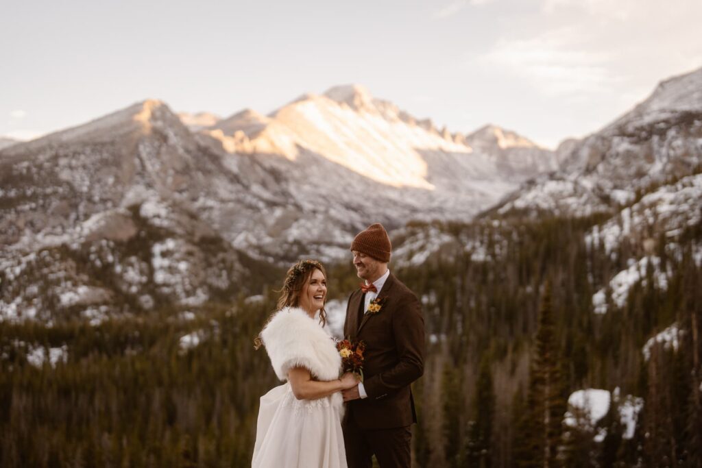 Couple hiking through the mountains of Colorado on their wedding day