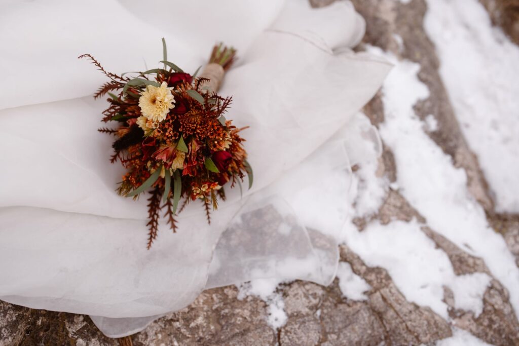 Autumn wedding florals, snow, and a wedding dress