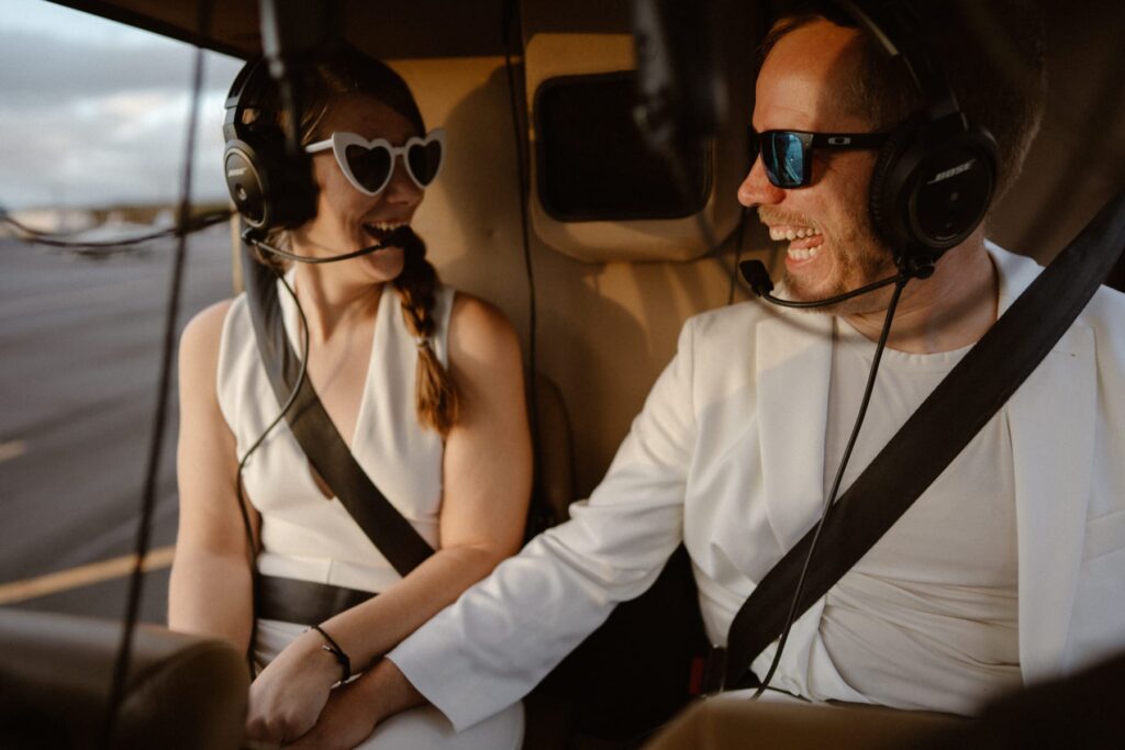 Couple trying a helicopter for the first time on their elopement day