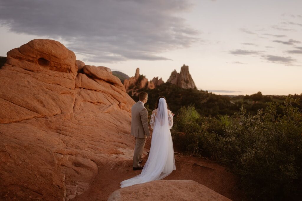 Couple looking off into the distance at their Garden of the Gods wedding