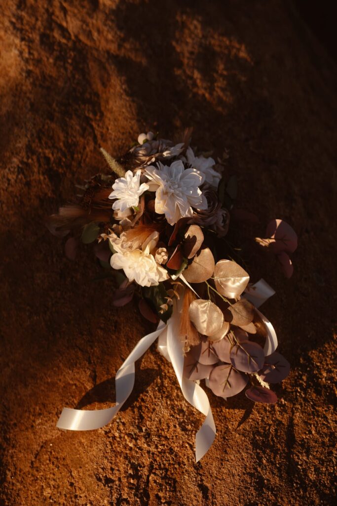 Silk floral bouquet on the red rocks
