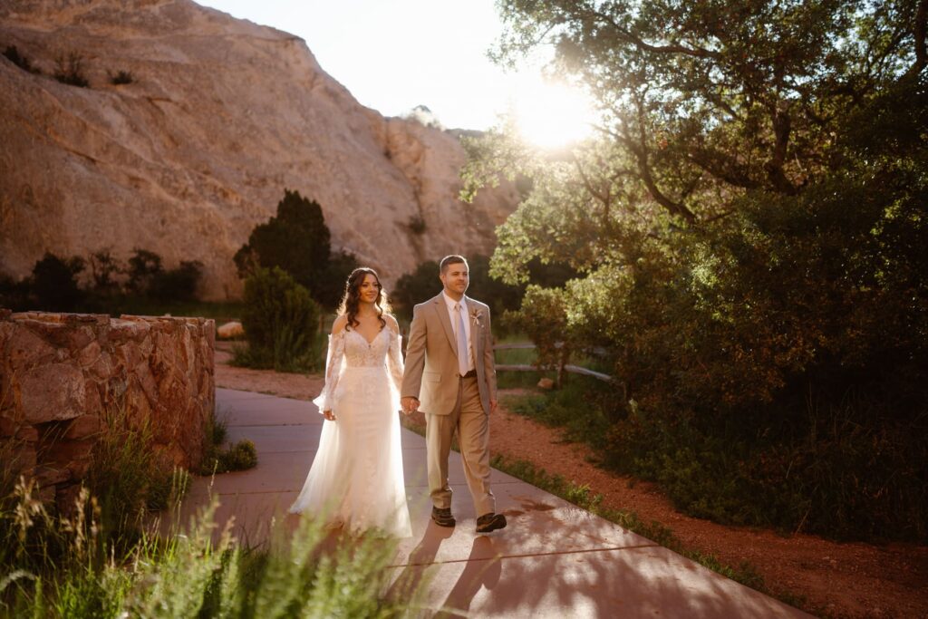 Couple walking through the paths of Garden of the Gods on their wedding day