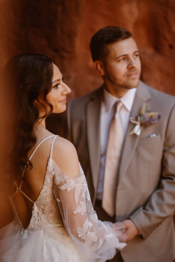 Romantic portraits of bride and groom amongst the red rocks