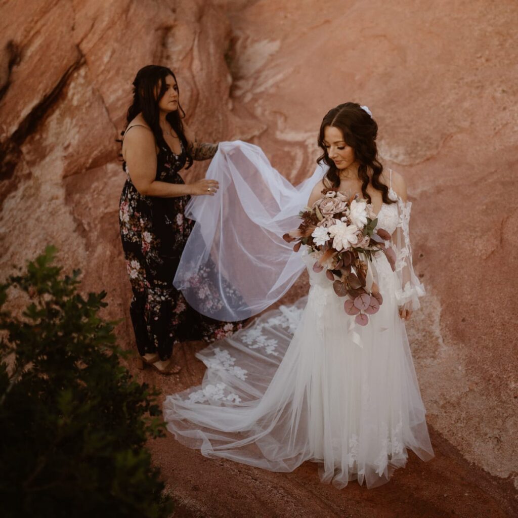 Bride and her best friend before a first look at Garden of the Gods