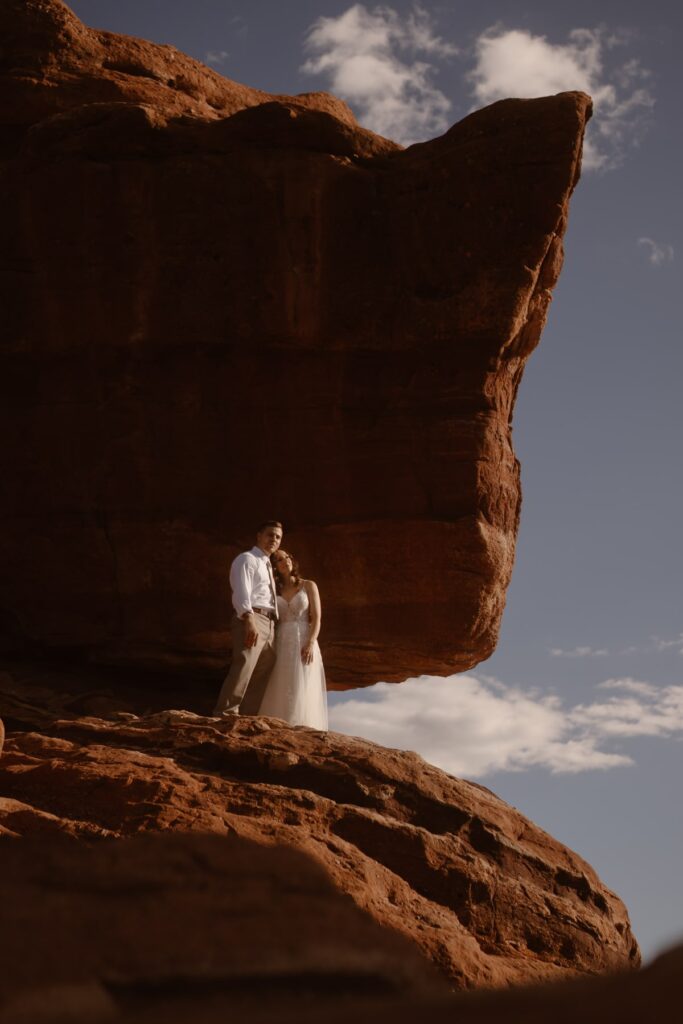Couple in front of Balanced Rock at Garden of the Gods in Colorado Springs