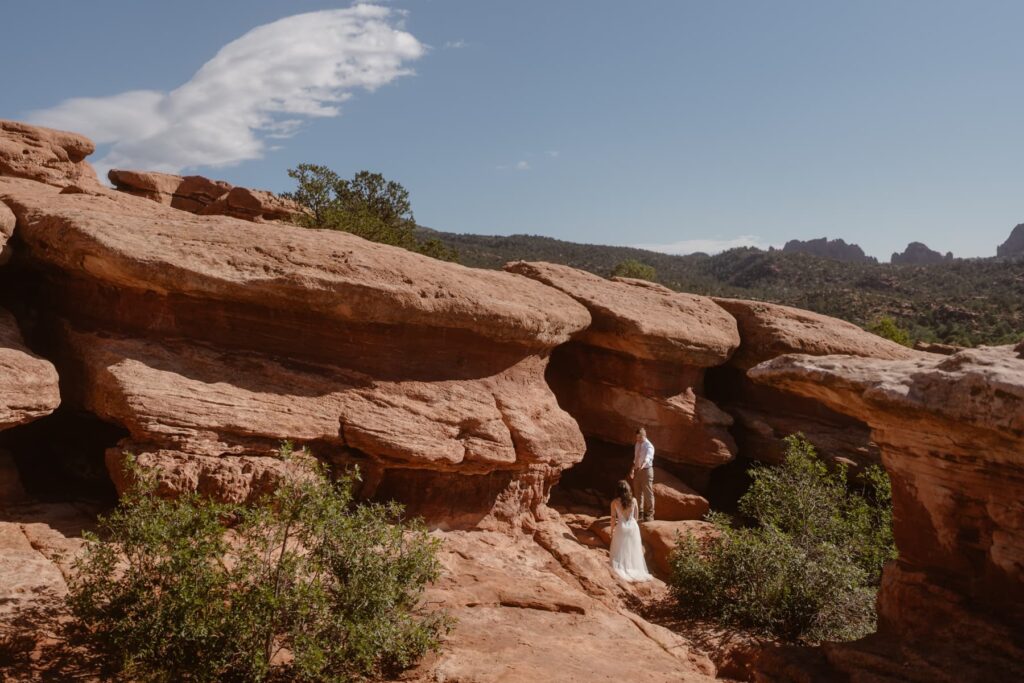Bride and groom exploring Garden of the Gods on their wedding day