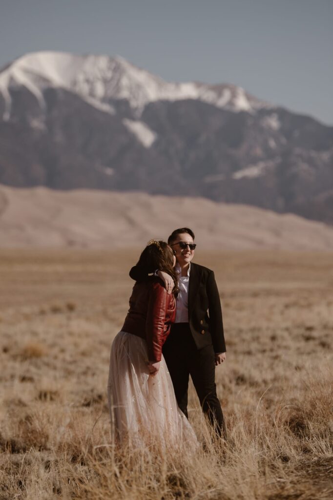 Wedding portraits with sunglasses in the mountains