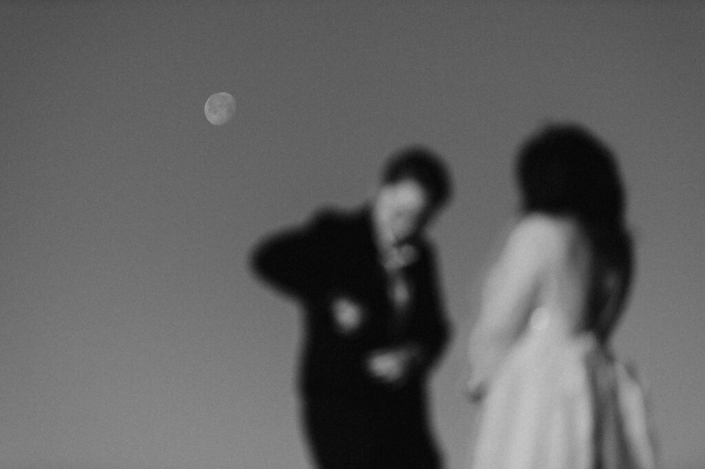 Wedding couple with moon in the background