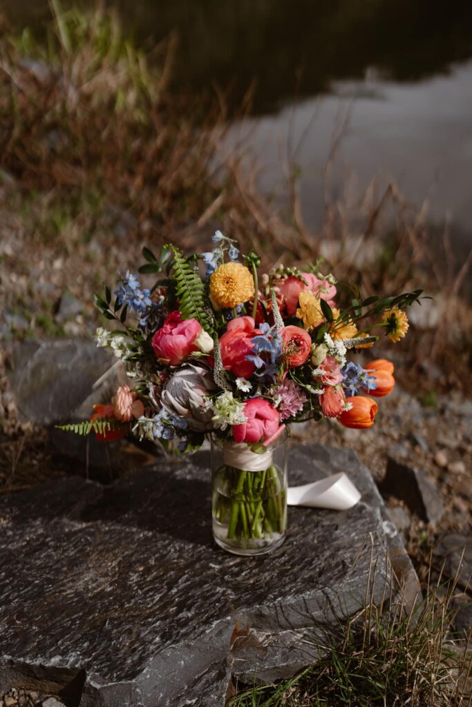 Bridal bouquet with pinks, yellows, and orangers