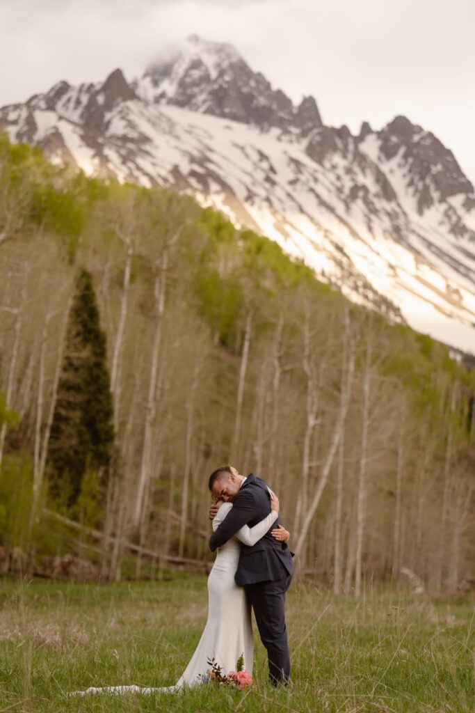 Post wedding ceremony hug in the mountains