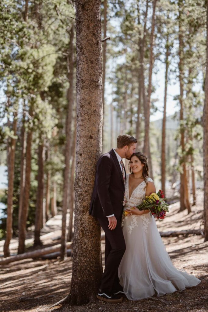 Couple in the forest on their wedding day in Rocky Mountain National Park