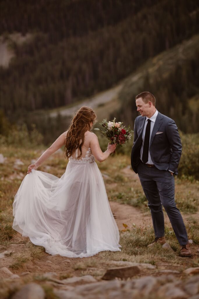 Bride and groom dancing in the mountains
