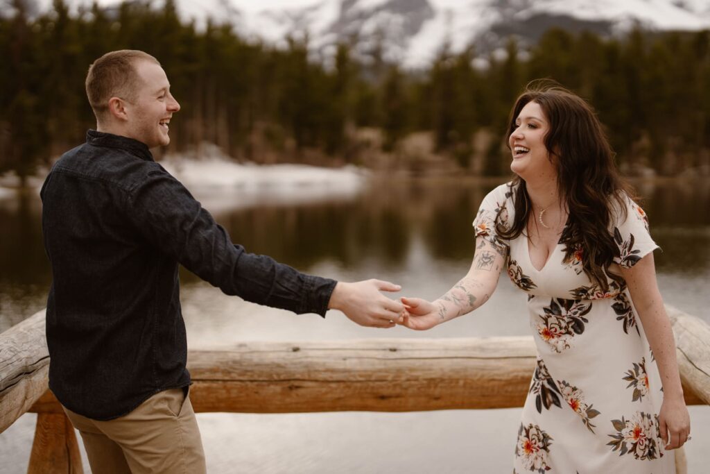 Couple laughing and acting playful during engagement photos