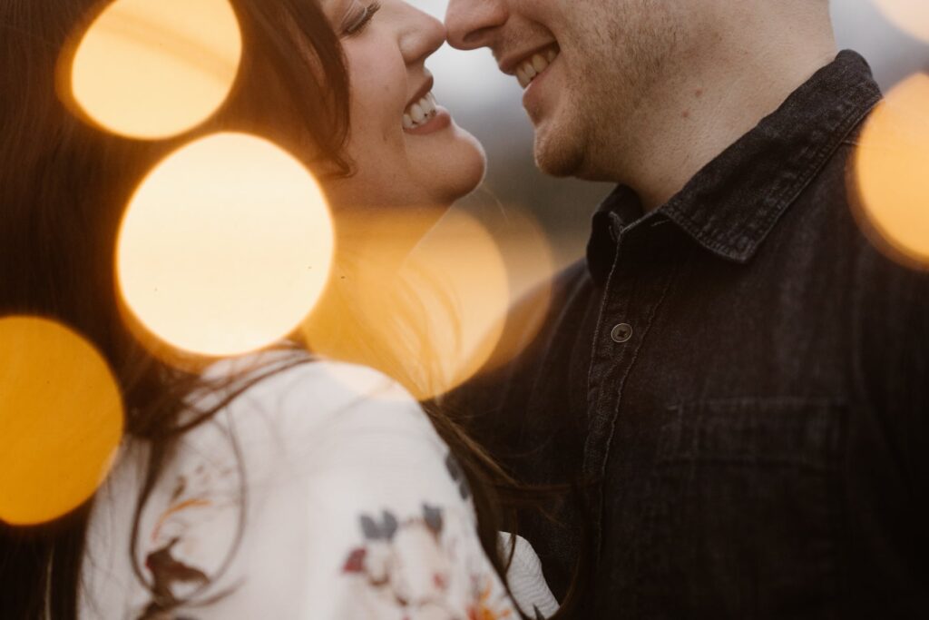 Romantic close up of couple with twinkling lights