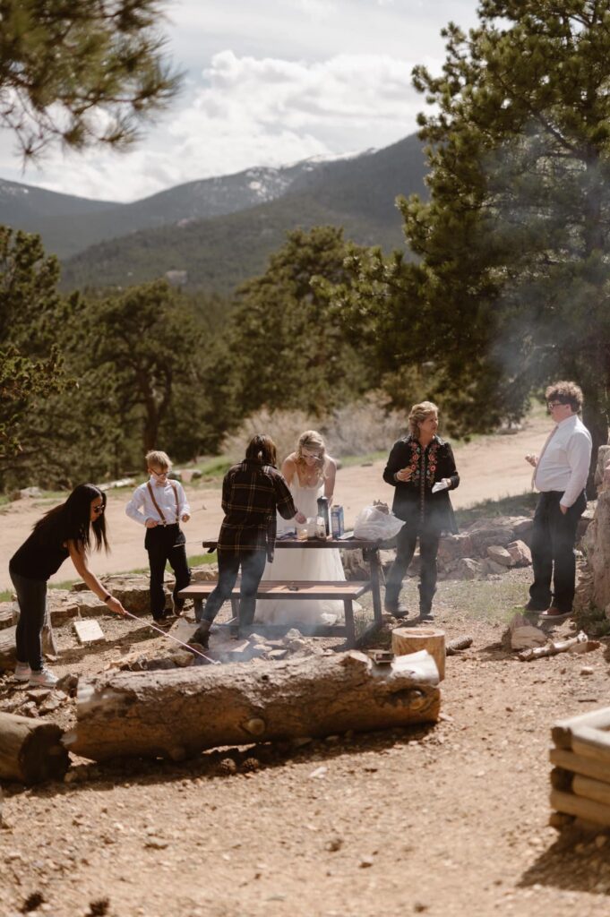 View of bridal party having a campfire at Ranchstead Inn in Estes Park