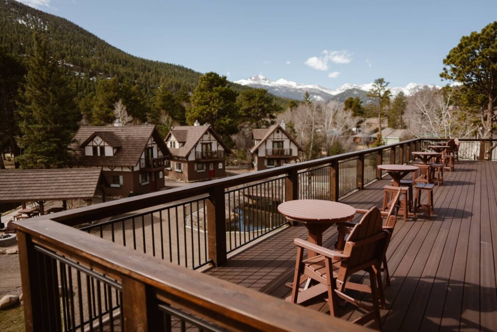 View of cocktail hour space and deck overlooking the mountains at The Landing at Estes Park