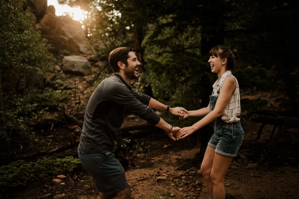 Couple excitedly dancing during couples portraits together